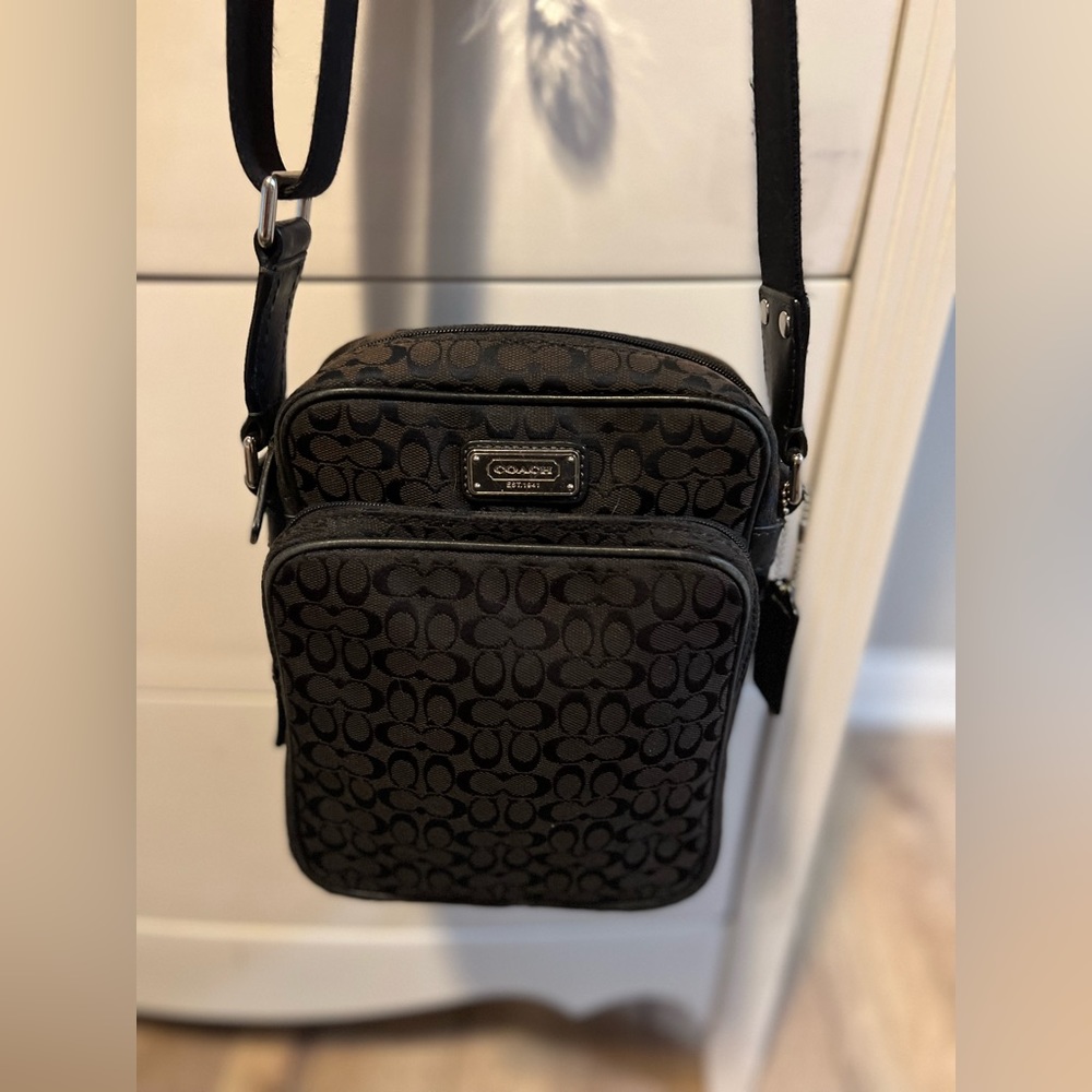Coach - Black Crossbody (Small) with front pocket.  Great condition.
